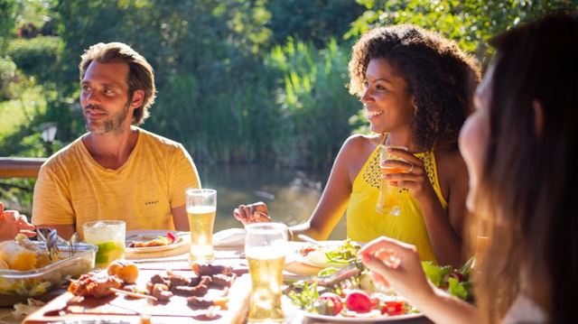 Group of people eating outdoors